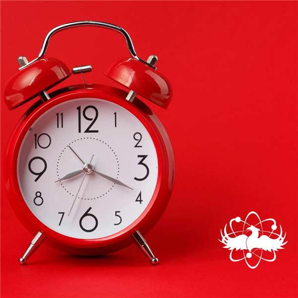  a red clock against a red background and the white phenix city schools logo